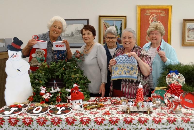 Women of St. George’s Chapel display some of the handcrafted items to be offered at the Christmas Fair Dec 2. Shoppers will find tree ornaments, wall hangings, wreaths, clef note candy canes and other articles on the Christmas list. Shown (l-r) are workers Liz Dixon, Pat Kline, Carol Wells, Cathy Graden and Betty Hatfield. SUBMITTED PHOTO